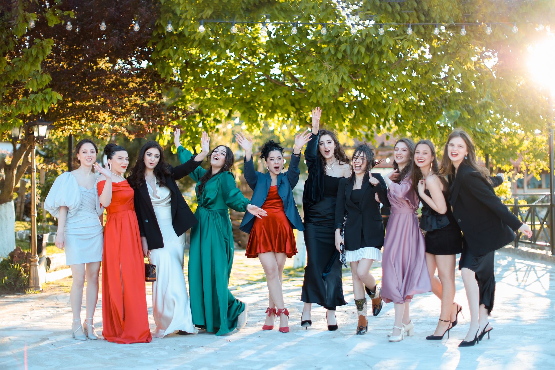Students celebrating together in colourful formal attire